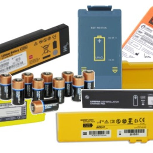 When should I replace the batteries in my defibrillator?